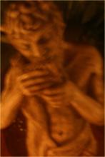 Pan playing panpipes